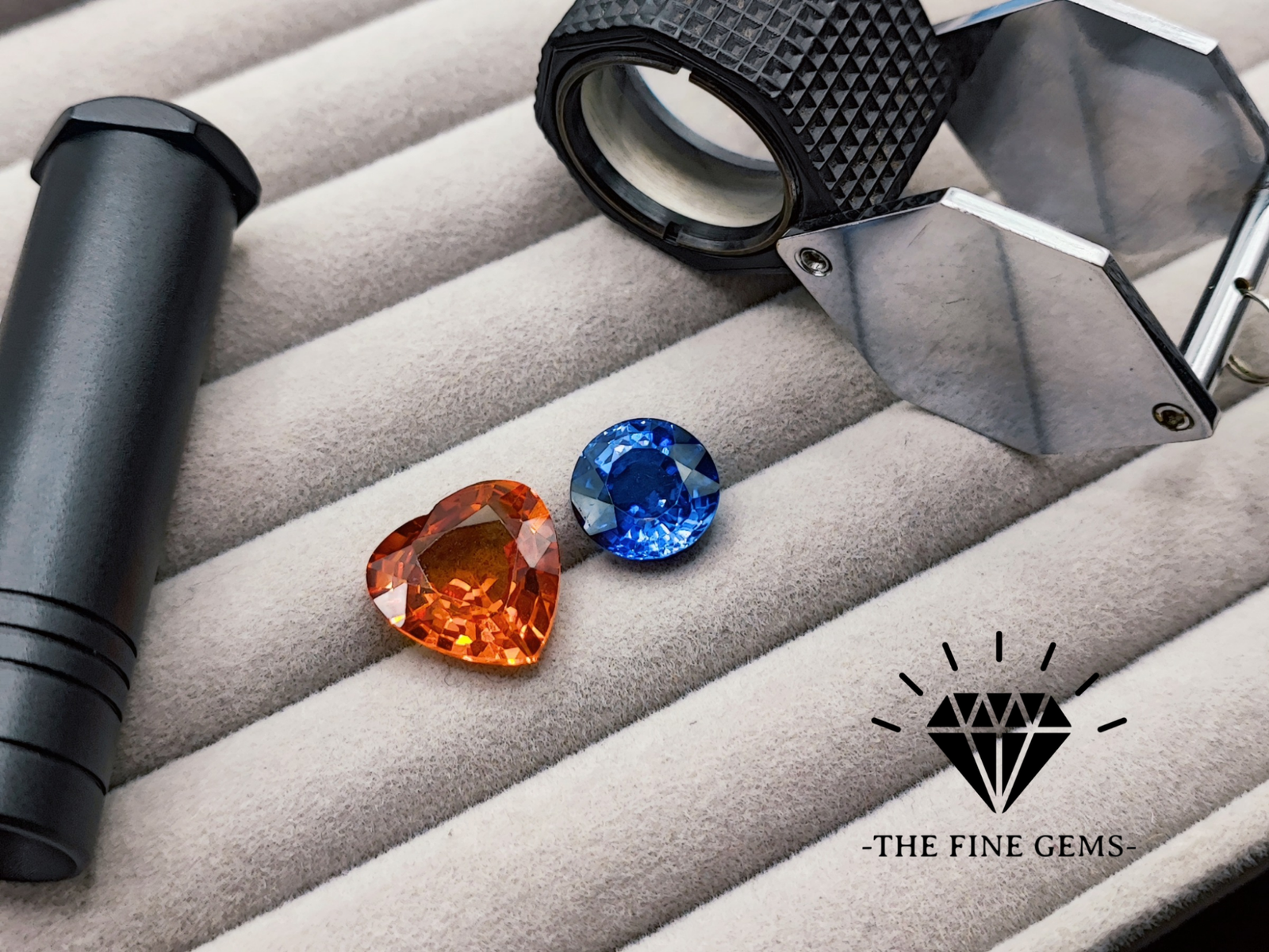 loupe de gemmologie citrine orange et saphir bleu logo noir