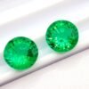 two green round cut lab emeralds 3.49 carats