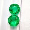 two green round cut lab emeralds 3.49 carats