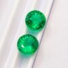 two green round cut lab emeralds 3.49 carats
