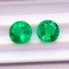 two green round cut lab emeralds 3.49 carats