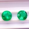 two green round cut lab emeralds 3.49 carats