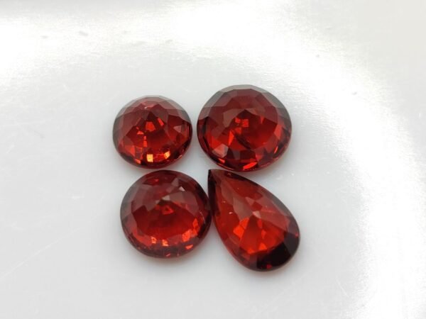 wonderful natural precious garnet gemstone , round and pear cut - blood pigeon color