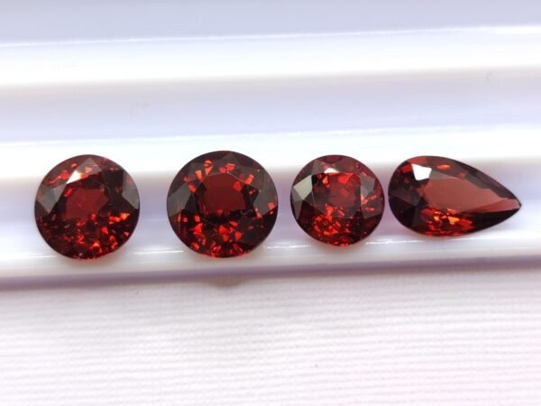 wonderful natural precious garnet gemstone , round and pear cut - blood pigeon color