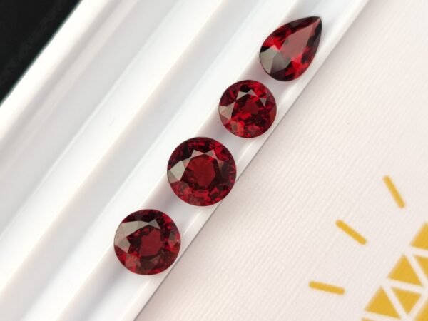 wonderful natural precious garnet gemstone , round and pear cut - blood pigeon color